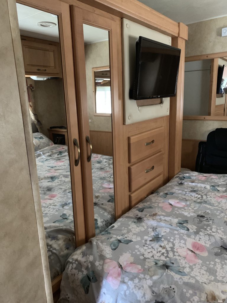 With the bedroom slide in, the wardrobe and all but two drawers are pressed against the bed